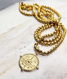 "《《 TRIBAL COLLECTION 》》 THE DETAILS The \"GOLDEN TRIBAL SHIELD\" Necklace is designed with an exquisitely detailed Gold Stainless Steel Tribal Shield Pendant, engraved to create an authentic Rustic appearance, hung from a Gold Stainless Steel Box Chain available in your choice of length! 🔶️🔹️🔶️View our entire TRIBAL COLLECTION here: https://www.etsy.com/shop/MrMacKJewelry?section_id=33102757 MATERIALS * 3/4\" Diameter Gold Stainless Steel Tribal Shield Pendant * 3mm Gold Stainless Steel Box Shield Necklace, Necklace Length Chart, Fish Hook Necklace, Arrowhead Necklace, Box Chain Necklace, Jewelry Care Instructions, Gold Box, Beaded Skull, Mens Gold