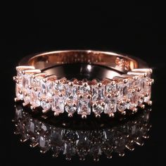 an image of a wedding ring with diamonds on it's sides and in the middle