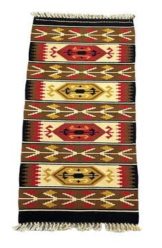 a brown, red and yellow rug with fringes on the bottom is shown in front of a white background