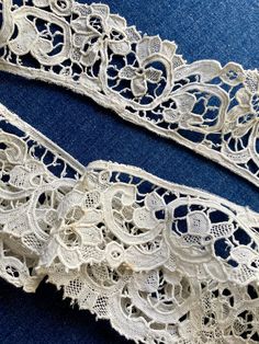 Beautiful Gros Point lace is hand made. There are buttonhole covered brides, delicate lace fillings and motifs of flowers. Lace measures about 2 inches in width with repeats about every 5 inches. Excellent antique condition, likely has been used as there is scat remnants of net along the edge. This piece has been made into a circle and likely made for a petticoat. Excellent antique condition with some loose and detached brides. Sold as is. This lace is about 2 yards and 32 inches in length. Antique white. Vintage Lace With Lace Trim For Ceremony, White Scalloped Lace For Vintage Events, Traditional Crochet Lace For Wedding, Victorian Scalloped Lace For Wedding, Vintage Wedding Fabric And Notions With Lace Trim, Vintage Cream Lace For Ceremonies, Vintage Cream Lace For Ceremony, Vintage Wedding Fabric With Lace Trim, Traditional Wedding Lace