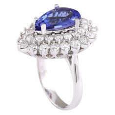 Stamped: 14K White GoldTotal Ring Weight: 9.3 GramsRing Length: N/ARing Width: N/AGemstone Weight: Total Natural Tanzanite Weight is 4.11 Carat (Measures: 13.55x9.40 mm)Color: BlueDiamond Weight: Total Natural Diamond Weight is 2.10 CaratColor: F-G, Clarity: VS2-SI1Face Measures: 24.17x19.03 mmSku: [703397W] Tanzanite Brilliant Cut Formal Rings, Formal Gia Certified Pear-shaped Rings, Tanzanite Halo Ring For Formal Occasions, Formal Tanzanite Halo Ring Fine Jewelry, Formal Tanzanite Rings With Prong Setting, Luxury Pear-shaped Sapphire Ring With Prong Setting, Formal Multi-stone Diamond Sapphire Ring, Elegant Multi-stone Pear-shaped Diamond Ring, Formal Multi-stone Sapphire Ring With Diamonds