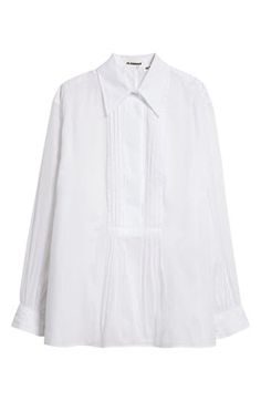 Clean pleats unfold into unexpected volume on an billowy cotton shirt designed with a hidden half placket and elongated point collar. 30 1/2" length (size 42) Hidden-button half placket Point collar Long sleeves Camisole lining 100% cotton Dry clean Made in Italy Designer Clothing Oversized Elegant Cotton Blouse, Long Sleeve Pleated Shirt For Work, Pleated Long Sleeve Shirt For Work, Oversized Cotton Blouse For Formal Occasions, Elegant Oversized Shirt With Fold Down Collar, Timeless Long Sleeve Cotton Blouse, Cotton Long Sleeve Blouse With Pintucks, Cotton Blouse With Pintucks For Work, Elegant Oversized Blouse With Placket