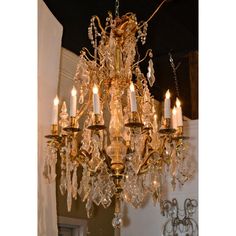 a chandelier hanging from the ceiling in a room