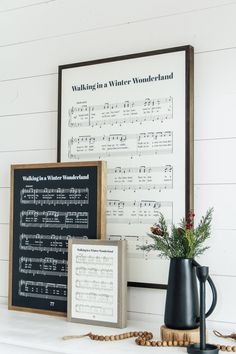 a fireplace mantle with music sheet and vase on it