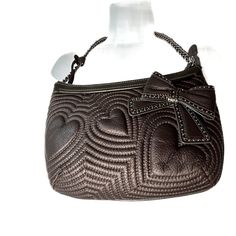 Brighton Brown Leather Shoulder Bag Hearts & Bows Nwt $190.00. E272350. Zip Closure, Animal Print Liner. Zip Compartments, 2 Pouches, Key Chain Inside, Chain Strap, 21" Long, 10" Arm Hole. Medium Size Bag. New With Tags. Very Mod, Great For Going Out And Holiday Party Season! 7718-67 Leather Shoulder Bag With Detachable Strap For Valentine's Day, Leather Satchel Bag For Valentine's Day, Leather Shoulder Bag For Valentine's Day Evening, Rectangular Leather Bag For Valentine's Day, Leather Shoulder Bag For Evening And Valentine's Day, Everyday Use Heart-shaped Leather Shoulder Bag, Valentine's Day Leather Shoulder Bag For Evening, Valentine's Day Leather Rectangular Bag, Chic Heart-shaped Leather Bag