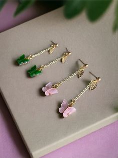 💫 Listing is for one pair of earrings only.  💫 Can choose between green or pink butterflies.  💫 The hardware and chain are gold colored. 💫 100% hypoallergenic. Perfect for sensitive ears.  💫 Perfect for Melanie Martinez Portals or Trilogy concert.  💫Stud style backing.  💫 Length is approximately 2.25 inches long. They're long but still very lightweight.  💫 Comes with 2 pairs of earring backs.  💫 Package is promptly shipped via Canada Post in a protective bubble mailer. 💫 This listing i Melanie Martinez Portals, Diy Jewelry Making Tutorials, Orange Necklace, Stud Style, Bubble Mailer, Canada Post, Jewelry Making Tutorials, Butterfly Earrings, Pink Butterfly