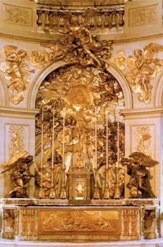 an ornate gold alter in a church