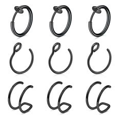 six pairs of black metal hoops on a white background, all in different shapes and sizes