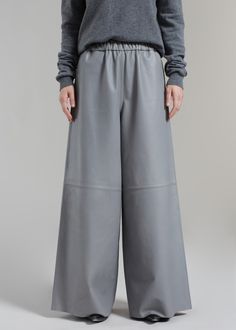 Color: Grey Midweight smooth leather Relaxed fit Wide leg Elasticated waistband Side seam hip pockets Slip-on style Unlined 100% Lamb Skin Dry Clean By The Frankie Shop. Made in India Luxury Leather High-waisted Pants, High-waisted Leather Pants With Pockets, Leather High-waisted Pants With Pockets, Modern Leather Trousers, Elegant Leather Bottoms With Pockets, Modern Leather Pants With Pockets, Modern Full Length Leather Pants, Modern Full-length Leather Pants, Modern Wide Leg Leather Pants