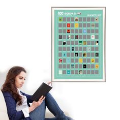 a woman sitting on a couch holding a book in front of a poster that reads 100 books