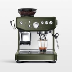 the sage green espresso machine is ready to be filled with coffee