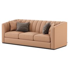 a tan couch with two pillows on it's back and the seat upholstered