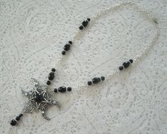 "This beautiful necklace has black obsidian beads, black czech glass beads, pewter silver accent beads, metal chain, sterling silver plated triple moon pendant, pewter silver pentacle and black obsidian stone. 18\" long. Sterling silver plated lobster clasp." Goddess Witch, Pentacle Necklace, Moon Pentacle, Wicca Jewelry, Wiccan Necklace, Black Obsidian Stone, Pentagram Necklace, Witch Necklace, Goddess Jewelry