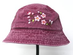 This hand embroidered cotton bucket hat is a stylish accessory that combines function with unique, handmade design. Made from high-quality cotton, it provides comfort and protection from the sun, making it perfect for outdoor activities. The intricate floral embroidery is meticulously crafted by hand, giving each hat a one-of-a-kind touch. Whether you're at the beach, camping, or just running errands, this cotton hat is both practical and fashionable. Item: flower embroidered bucket hat Material: 100% cotton Size: one size fits most Embroidery: hand made with acrylic thread Free first class shipping, upgradable priority mail service. 30 days return policy, feel confident at your purchase! Spring Embroidered Sun Hat With Short Brim, Embroidered Bucket Hat For Spring, Embroidered Brimmed Bucket Hat For Spring, Spring Embroidered Brimmed Bucket Hat, Spring Embroidered Bucket Hat, Casual Embroidered Sun Hat With Curved Brim, Spring Embroidered Wide Brim Bucket Hat, Embroidered Cotton Bucket Hat, Bohemian Cotton Bucket Hat For Spring