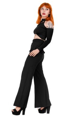 The moon made me do it. Loretta is an elegant pair of trousers designed for the stylish and refined woman. Made from a blend of materials consisting of 65% rayon, 30% polyester, and 5% spandex, these pants are not only beautiful but also wrinkle-resistant, ensuring they look perfect throughout the day. The incredibly high waist of these trousers not only has the ability to slim the silhouette but also elongate the legs, imparting elegance and confidence. The concealed zipper with a crescent moon-shaped pull adds a unique charm and a touch of mystery. Furthermore, these pants are equipped with practical side pockets for convenient storage of essentials. The flared seams towards the bottom give these trousers a light and elegant look, creating a bell-bottom effect that is both fashionable an Chic Evening Bottoms In Viscose, Chic Evening Pants In Viscose, Chic Wide Leg Elastane Pants For Party, Elegant Stretch Viscose Pants, Elegant Stretch Wide Leg Viscose Pants, Elegant Stretch Viscose Wide Leg Pants, Stretch Viscose Ankle-length Wide Leg Pants, Fitted Wide-leg Pants For Night Out, Viscose Evening Trousers