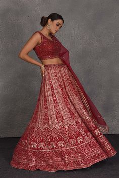 Be the center of attraction at weddings in this beautiful red embroidered designer lehenga. It comes with a matching net dupatta. DISCLAIMER: The actual product may vary slightly from the image. These are custom orders, hence expect slight variation in color and placement of the motif or buta. ESTIMATED DELIVERY: Because this is a custom order, it would take about 4 weeks from the date of purchase. RETURN POLICY: This product is a custom order and cannot be returned or exchanged. Bollywood Red Embroidered Fabric With Sheer Dupatta, Red Embroidered Fabric With Sheer Dupatta For Reception, Red Embroidered Fabric With Sheer Dupatta For Diwali, Festive Red Embroidered Fabric With Sheer Dupatta, Red Anarkali Lehenga With Intricate Embroidery, Red Semi-stitched Lehenga With Sheer Dupatta, Semi-stitched Red Lehenga With Intricate Embroidery, Red Floor-length Lehenga With Resham Embroidery, Red Embroidered Lehenga For Reception