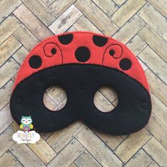 a ladybug mask is laying on the floor