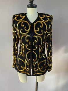 Vintage handmade sequined evening jacket by Stenay. Made in India. 100% silk. Size S. Excellent condition. There are hidden hooks all the way down the front to wear it closed. Long Sleeve Sequined Blazer For Evening, Gold Sequined Long Sleeve Blazer, Elegant Gold Sequined Blazer, Gold Sequin Blazer For Evening, Elegant Gold Sequin Blazer, Elegant Holiday Blazer With Sequins, Elegant Gold Outerwear With Sequins, Winter Silk Blazer For Party, Winter Party Silk Blazer