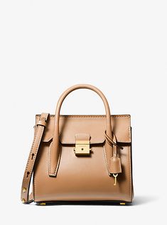 Reimagined in a compact silhouette, our coveted Campbell is a forever bag—effortless, elegant and timeless. This striking satchel is finely crafted in Italy from supple leather with polished hardware and a suede-lined interior. A push-lock fastening opens to a pocketed interior thoughtfully designed to store a day’s worth of essentials. Polished and pragmatic, it works just as well styled with a tailored dress as it does with jeans and your favorite blazer. Everyday Luxury Leather Shoulder Bag With Turn-lock Closure, Leather Shoulder Bag With Turn-lock For Everyday Luxury, Everyday Luxury Calf Leather Bags With Turn-lock Closure, Luxury Everyday Calf Leather Bag With Turn-lock Closure, Classic Calf Leather Satchel For Everyday Luxury, Modern Leather Satchel With Turn-lock Closure, Timeless Leather Satchel With Palladium Hardware, Timeless Satchel With Leather Lining For Everyday Luxury, Leather Satchel With Turn-lock For Work