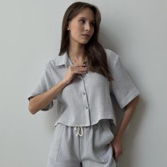 Elevate your seasonal wardrobe with our Muslin Shirt with Short Sleeves, perfect for warm weather. This crinkle cotton crop blouse offers a relaxed fit, ensuring comfort and style for any occasion. Made from soft, breathable gauze fabric, this loose top is ideal for casual outings or layering with your favorite pieces. Available in a variety of colors, it effortlessly combines versatility and chic elegance. Perfect for day-to-night wear, this must-have blouse will keep you cool and fashionable a Summer Tops With Crinkle Texture For Daywear, Casual Crinkle Texture Top For Daywear, Summer Crinkle Texture Top For Daywear, Beach Tops With Crinkle Texture And Short Sleeves, Summer Button-up Blouse With Crinkle Texture, Casual Crinkle Texture Top For Vacation, Summer Cotton Shirt With Crinkle Texture, Cotton Tops With Crinkle Texture For Vacation, Cotton Top With Crinkle Texture For Vacation