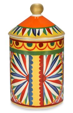 a colorful container with an orange lid and gold top on a white background, it is decorated with multicolored designs