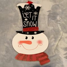 a snowman wearing a top hat and scarf with the words tij wonz written on it