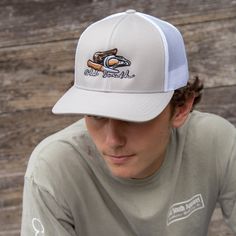 Keeping the hot southern sun out of your eyes and away from your face is important during the heat of June, July and August--both for guys and gals. Our classic, wide-brimmed trucker hat subtly announces your southern roots while shading your head and face. Crown: Structured Pro Crown | Pro-Stitched Finish | Adjustable Snap-Back Visor: Pre-Curved | Curved or Flat - Shape It How You WantSweatband: 3-Part Comfort Cotton FitClosure: Plastic Adjustable Snap-Back Sizes: Adult | One Size Fits Most White Flat Bill Sun Hat For Outdoor, Spring Trucker Hat For Outdoor Activities, Curved Bill Hats For Summer Outdoor, Curved Bill Hats For Summer Outdoor Activities, Spring Outdoor Trucker Hat With Curved Brim, Curved Bill Hat For Summer Outdoor, Summer Outdoor Hat With Curved Bill, Flat Brim Trucker Hat For Summer Outdoor, Summer Outdoor Trucker Hat With Flat Brim