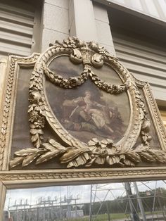 an ornate painting on the side of a building