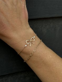 This adorable Ellie bow bracelet is the perfect accessory to add a touch of charm and sweetness to any outfit. Handmade with the best materials. Measurements: Small 6.5", Medium 7", Large 7.5" Available in 14k Gold Fill, 14k Rose Gold Fill, Sterling Silver Bow Pendant .75" Bow Pendant, Bow Bracelet, Shiny Objects, The Muse, Silver Bow, Rose Gold Jewelry, Make Yourself, Bead Bracelet, Sterling Silver Bracelets