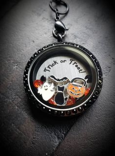 "This listing is for one Halloween floating locket necklace or Plate and Charm set only. What you will receive: 1-30mm Black Stainless Steel Floating Locket with a magnetic/black crystal face 1-24\" Black Stainless Steel Floating Locket Necklace Chain with a locket ring Plate and Charm Set: 1-Stainless Steel Window Plate that reads 'Trick or Treat' 1-Black Cat Floating Charm 1-Bat Floating Charm 1-Ghost Floating Charm 1-Pumpkin Candy Pal Floating Charm 8-Stardust Crystals (4 Orange & 4 Black Cat Floating, Geneseo Ny, Locket Ring, Ring Plate, Floating Lockets, Pumpkin Candy, Floating Charms, Treat Gift, Locket Charms