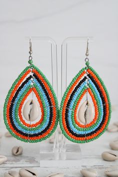 Beaded earrings. Beautifully handmade my Kenyan artisans. Colorful Beaded Teardrop Earrings For Beach, Unique Festival Earrings With Dangling Beads, Teardrop Earrings With Colorful Beads For Beach, Teardrop Beach Earrings With Colorful Beads, Unique Teardrop Jewelry With Colorful Beads, Unique Teardrop-shaped Jewelry With Colorful Beads, Traditional Handmade Green Hoop Earrings, Beaded Teardrop Jewelry For The Beach, Unique Beaded Teardrop Jewelry