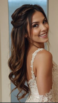 a woman with long hair wearing a white dress