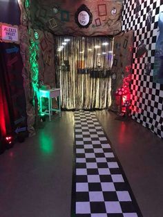 a black and white checkered floor in front of a wall with clocks on it