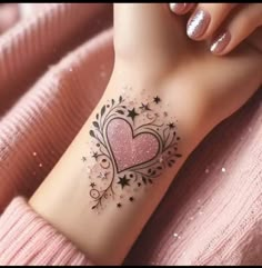 a woman's arm with a pink heart tattoo on her left side and stars around it