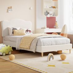 a child's bedroom with toys on the floor, and a bed in the middle