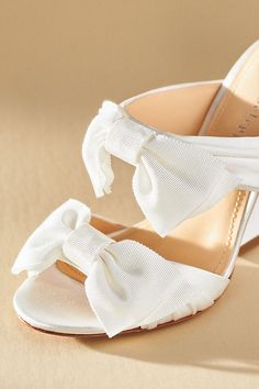 The Dee Ocleppo Burgundy Satin Bows Mule Sandals exude luxurious femininity with their rich satin and bold bow embellishments, making them the perfect statement footwear for any elegant occasion. | Burgundy Satin Bows Mule Sandals by Dee Ocleppo in White, Women's, Size: 40, Leather/Satin at Anthropologie Summer Wedding Shoes Satin Closed Toe, Summer Wedding Shoes In Satin With Closed Toe, Summer Satin Wedding Shoes With Closed Toe, Spring Event Heels With Satin Bow, Summer Evening Heels With Satin Bow, Spring Gala Heels With Bow Detail, Spring Gala Heels With Bow, Spring Evening Wedding Shoes With Satin Bow, High Heels With Bow Straps For Events