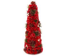 a tall christmas tree made out of red flowers and pine cones on a white background