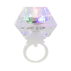 a ring that is sitting on top of a white surface with lights in the middle