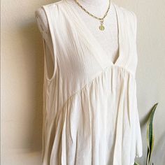 Sleeveless Ivory Top 100% Rayon. Just Bought At Local Boutique Never Been Worn Beige Sleeveless Blouse For Beach, Chic Cream Tank Top, Chic Beige Sleeveless Tank Top, Bohemian Sleeveless Tops For Daywear, Chic Beige Tank Top For Spring, Beige Summer Tank Top, Chic Flowy Sleeveless Blouse Tank Top, Neutral Sleeveless Summer Tank Top, Chic Flowy Sleeveless Tank Top