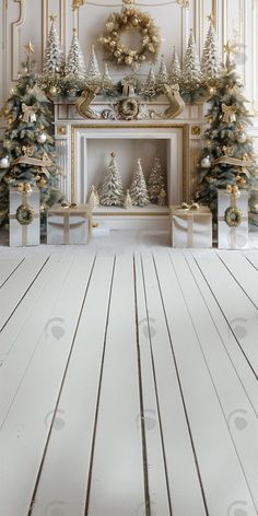 a room decorated for christmas with white and gold decorations on the fireplace mantels