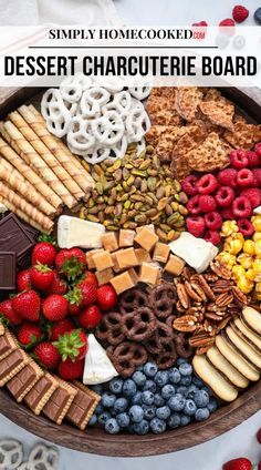 a wooden platter filled with different types of snacks