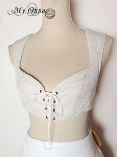 creation My Oppa steampunk 2021 https://www.facebook.com/myoppa.creations Crop top beige pattern fabric fully lined in white cotton lacing front and back (to adjust) not corseted Available chest size (if you have any doubts contact me  T.34 / 36: Minimum 85cm (approximately + 4cm) T.38 / 40: Minimum 90cm (approximately + 4cm) T.42 / 44: Minimum 95cm (approximately + 4cm) Your purchase will be shipped by registered Colissimo for France For countries outside the European Union, additional tax (or Steampunk Shorts, Steampunk Mode, Red Floral Skirt, Top Flowers, Steampunk Top, Unique Skirts, T 34, Clothing Summer, Medieval Fashion