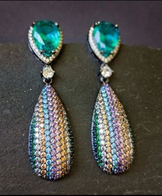 Sparkling Visual Flaunt your special occasion outfits with this contemporary large tear drop earrings in pave setting with micro multi colored cubic zircons These would make a perfect versatile gift Length: 2.25 Inches Shipping is free for orders $30 and above. Cheap Multicolor Teardrop Earrings, Pear-shaped Cubic Zirconia Earrings For Party, Party Pear-shaped Cubic Zirconia Earrings, Pear-shaped Earrings For Party With Pierced Ears, Multicolor Teardrop Earrings For Party, Party Pear-shaped Earrings For Pierced Ears, Party Pear-shaped Earrings, Teardrop Pendant Earrings For Party, Party Long Drop Earrings With Sparkling Stones