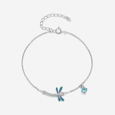 The elegant dragonfly design of this piece, formed by the gradual blend of blue-green enamel and sparkling zircons, captures the endless beauty of spring in its graceful form. This timeless piece adds a special touch to any look, elevating it into a piece of art. An eye-catching combination of stylish design and unrivaled craftsmanship make this bracelet a must-have for any jewelry collection. Gender: Women Bracelets Type: Chain & Link Bracelets Main Stone: Zircon Item Weight: 1.5 g Style: TREND Elegant Blue Bracelets With Adjustable Chain, Nickel-free Blue Dangle Bracelets, Elegant Green Dragonfly Shaped Jewelry, Handmade Green Dragonfly Jewelry, Butterfly-shaped Sterling Silver Bracelet, Nickel-free Blue Dragonfly Jewelry, Girlfriend Anniversary, Ear Cuff Jewelry, Dragonfly Bracelet