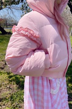 This super-cute pastel pink puffer features puffy bear ears, a gold zipper and buttons, and ruffle detailing on the sleeves. The Pink Marshmallow Bear Puffer is light enough for a cool Spring day and like the name implies - it's super fluffy like a marshmallow! Perfect for a day in the park or running errands in style. Model wearing size S. Trendy Puff Sleeve Outerwear For Spring, Casual Puff Sleeve Outerwear For Spring, Pink Zipper Closure Outerwear For Spring, Spring Puffer Jacket With Zipper Closure And Long Sleeves, Spring Puffer Jacket With Zipper Closure, Casual Fluffy Outerwear For Spring, Pink Hooded Puffer Jacket For Spring, Spring Puffy Outerwear, Trendy Long Sleeve Outerwear With Ruffles