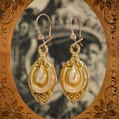 This stunning pair of 9ct gold Etruscan Revival antique drop earrings date to the Victorian period. They are beautifully carved with hints of a horseshoe shape in each for good luck, and hang daintily from the ear for a truly charming, classic look. Etruscan revival jewellery, which emerged in the late Georgian period, and took root in Victorian Britain during the archaeological craze. New technology permitted jewellers to work their materials in ways never seen before, and these pieces were cha Antique 14k Gold Hallmarked Earrings, Historical Yellow Gold Drop Earrings, Victorian Hallmarked 14k Gold Earrings, Yellow Gold Historical Drop Earrings, Yellow Gold Drop Earrings With Historical Design, Antique Gold Earrings With Historical Design, Victorian 14k Gold Earrings, Victorian 14k Gold Drop Earrings, Antique Hallmarked 14k Gold Earrings