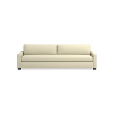 a white couch sitting on top of a white floor