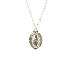 Virgin Mary medallion necklace, miraculous medal necklace, catholic, protection, a sterling silver mother of god on a sterling silver chain This sterling silver Virgin Mary hangs from a sterling silver chain in the length of your choice. This pendant is also available in 14k gold vermeil on a 14k gold filled chain. Charm measurements: 12mmx10mm. Looking for other charm necklaces? https://www.etsy.com/shop/BubuRuby?section_id=12318467 More crystals and healers? http://www.etsy.com/shop/BubuRuby?s Silver Sterling Oval Charm Necklaces, Silver Oval Sterling Silver Charm Necklace, Oval Silver Sterling Silver Charm Necklaces, Sterling Silver Charm Necklaces With Coin Pendant, Sterling Silver Charm Necklace With Coin Pendant, Sterling Silver Charm Necklace With Oval Coin Pendant, Spiritual Sterling Silver Necklace With Miraculous Medal, Nickel-free Sterling Silver Medallion Necklace, Dainty Silver Charm Necklace With Oval Pendant