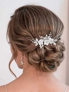 a woman wearing a wedding hair comb