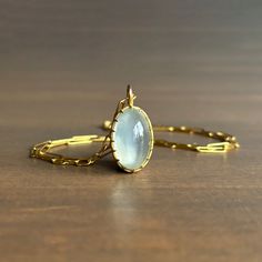 Dreamy sage green light beams from within this entrancing moonstone, grasped by Rosanne Pugliese's stunning scallop prong setting. 18k yellow gold Moonstone 12mm x 19mm (1/2" x 13/16") Pendant can be purchased alone or with the following chain options: • 22k yellow gold link chain, 18" long • 14k medium link chain, adjustable 17.5" & 19" • 14k medium link chain, adjustable 18.5" & 21" • 14k fine chain, adjustable 18" & 22" Sage Green Light, Gold Link Chain, Design Movements, Newport Ri, Gold Link, Light Beam, Cabochon Pendant, Green Light, 22k Gold